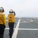 Sailors aboard the USS Howard conduct flight quarters in the South China Sea