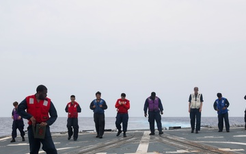 Sailors aboard the USS Howard conduct flight quarters in the South China Sea