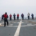 Sailors aboard the USS Howard conduct flight quarters in the South China Sea