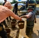 DPAA Personnel Clear Mud From Retention Pond