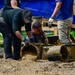 DPAA Personnel Clear Mud From Retention Pond