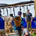 DPAA Personnel Clear Mud From Retention Pond