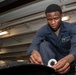 A Sailor conducts restoration efforts in the forecastle of USS Carl Vinson