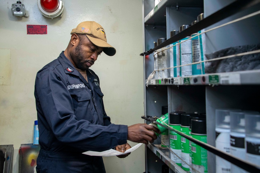 A Sailor checks out hazmat for shipboard personnel aboard Nimitz-class aircraft carrier USS Carl Vinson