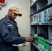 A Sailor checks out hazmat for shipboard personnel aboard Nimitz-class aircraft carrier USS Carl Vinson