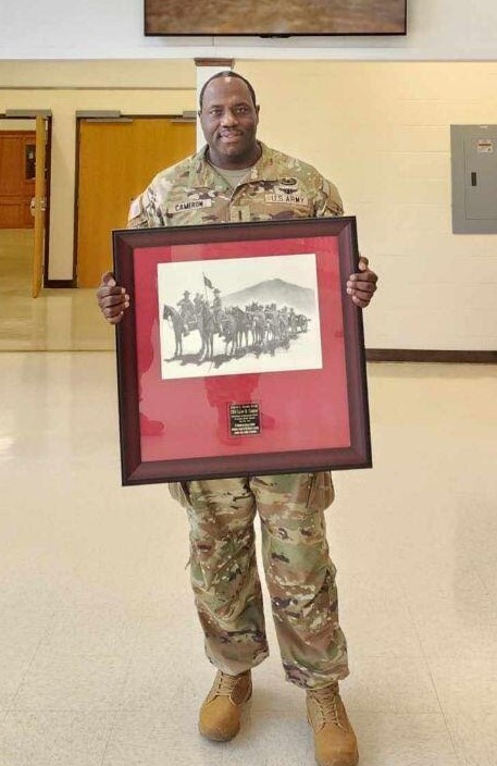 CW4 Cameron with his award