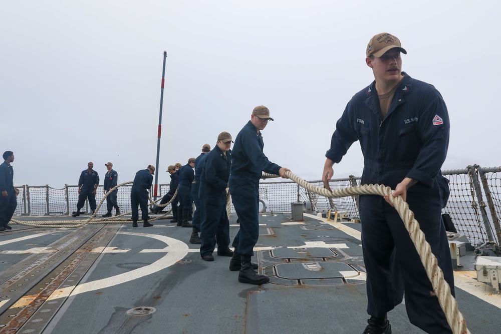 Sailors aboard the USS Howard conduct a sea and anchor detail in Okinawa, Japan