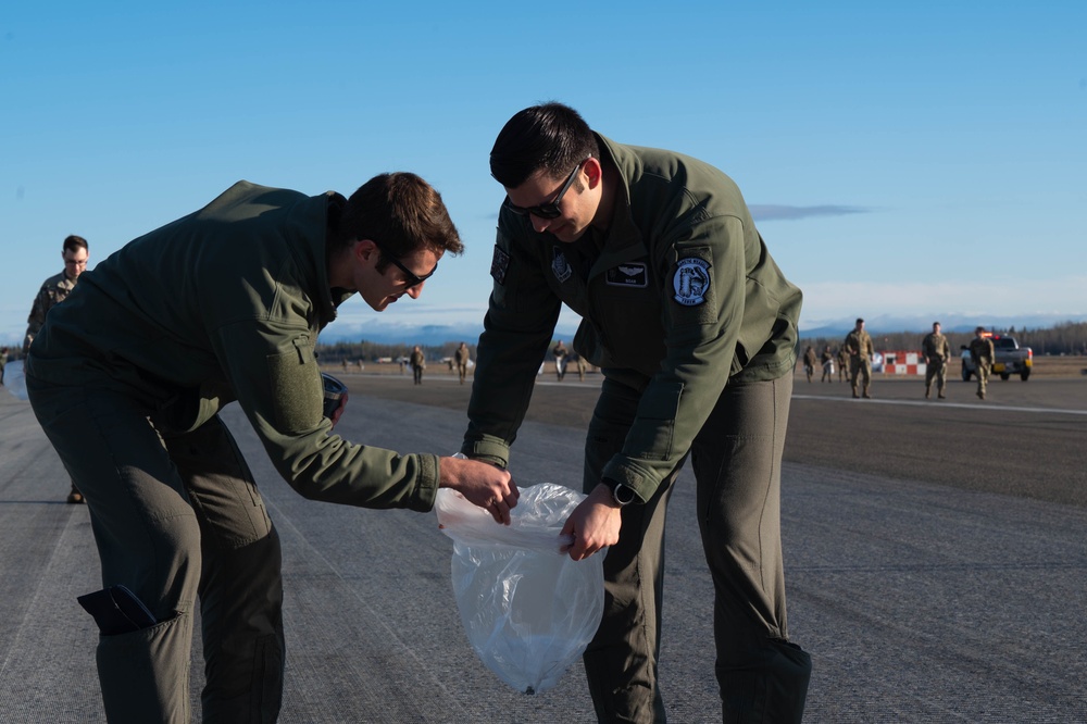 354th Airmen clean the flightline