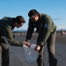 354th Airmen clean the flightline