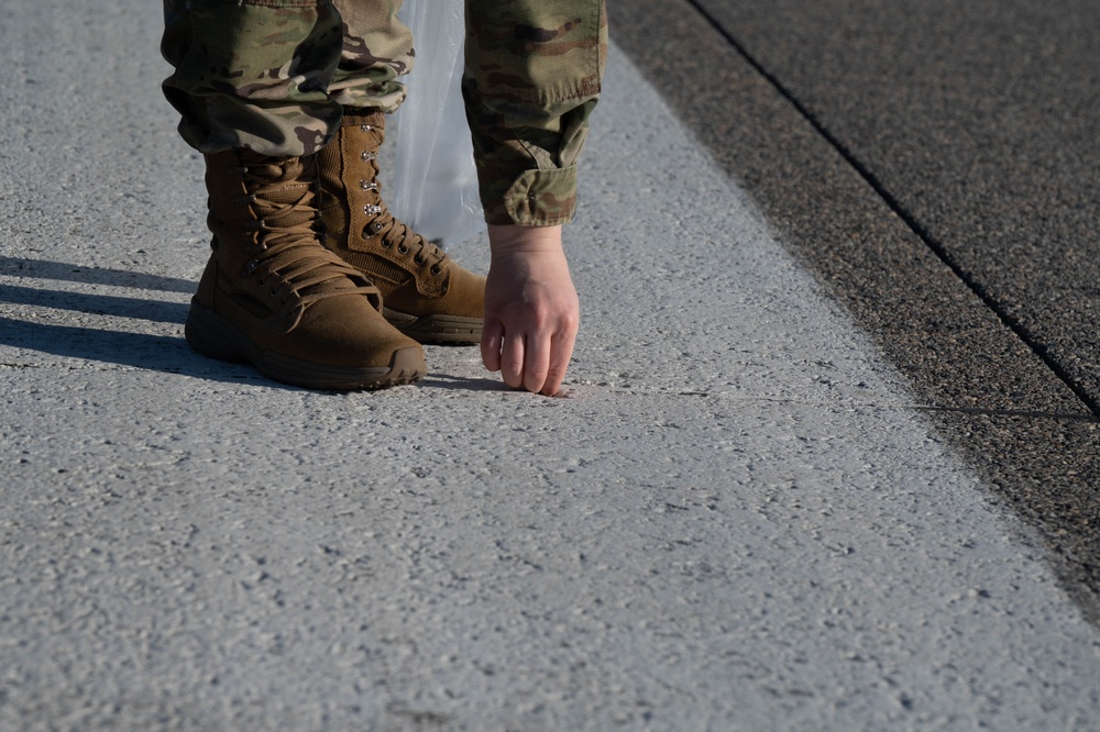 354th Airmen clean the flightline
