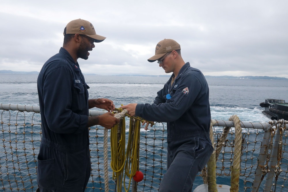 Sailors aboard the USS Howard conduct a sea and anchor detail in Okinawa, Japan