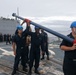 Sailors aboard the USS Howard conduct a sea and anchor detail in Okinawa, Japan