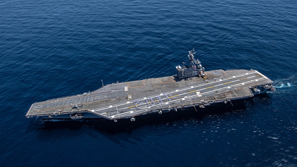 USS Ronald Reagan (CVN 76) Sailors bid farewell to Japan with flight deck message