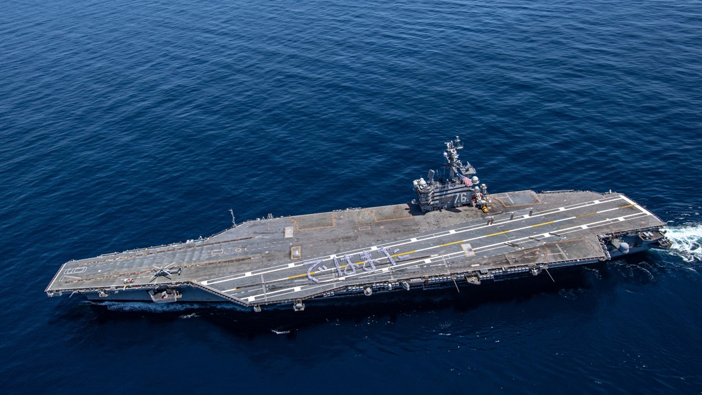 USS Ronald Reagan (CVN 76) Sailors bid farewell to Japan with flight deck message