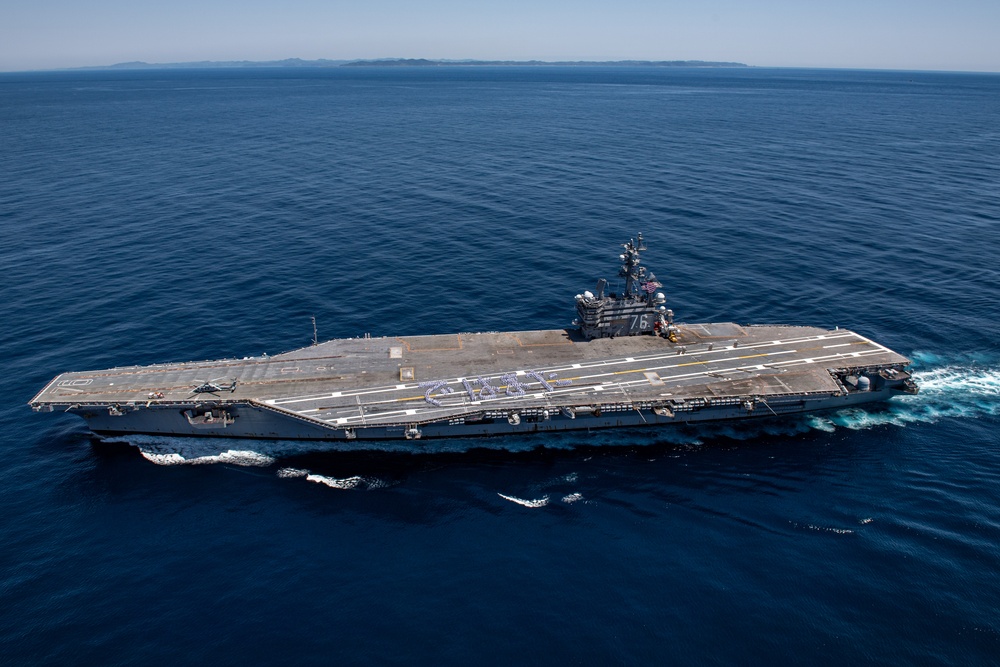 USS Ronald Reagan (CVN 76) Sailors bid farewell to Japan with flight deck message