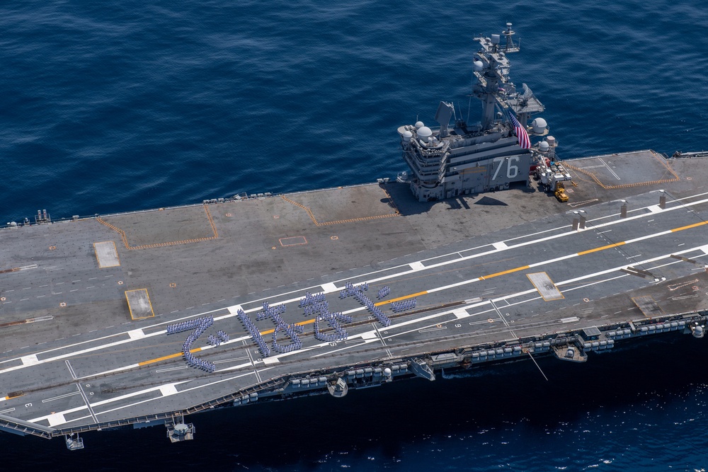 USS Ronald Reagan (CVN 76) Sailors bid farewell to Japan with flight deck message