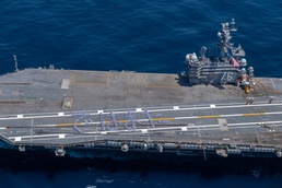 USS Ronald Reagan (CVN 76) Sailors bid farewell to Japan with flight deck message