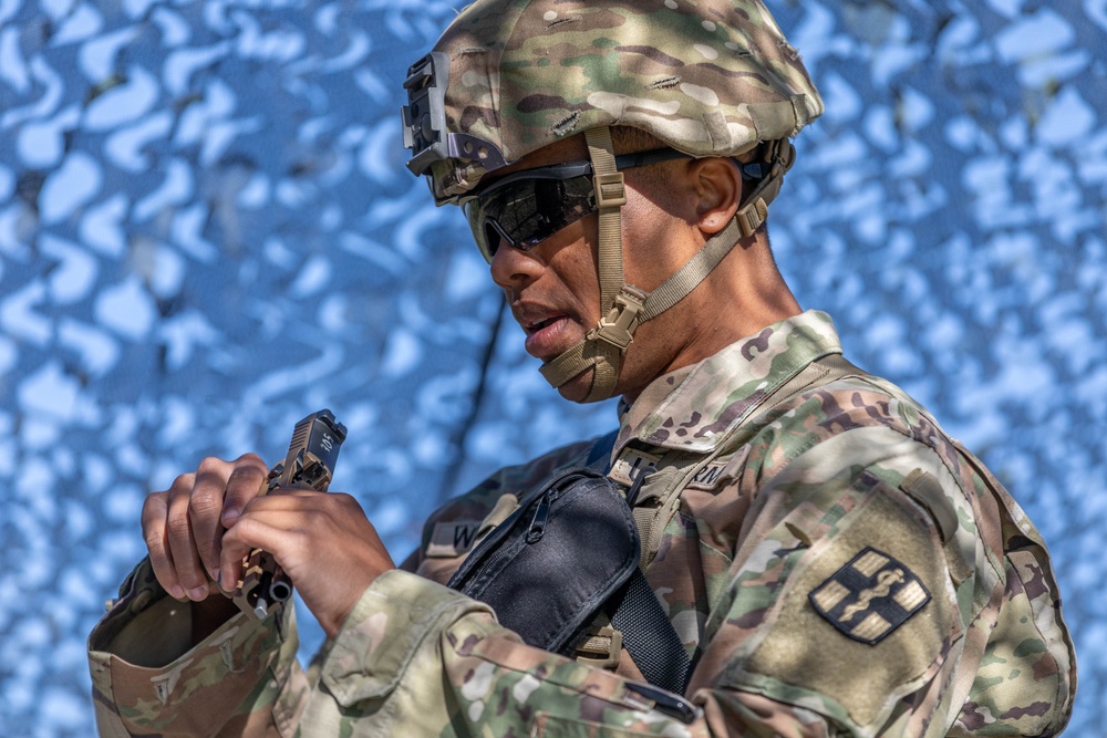 Spc. Brock Williams checks an M17