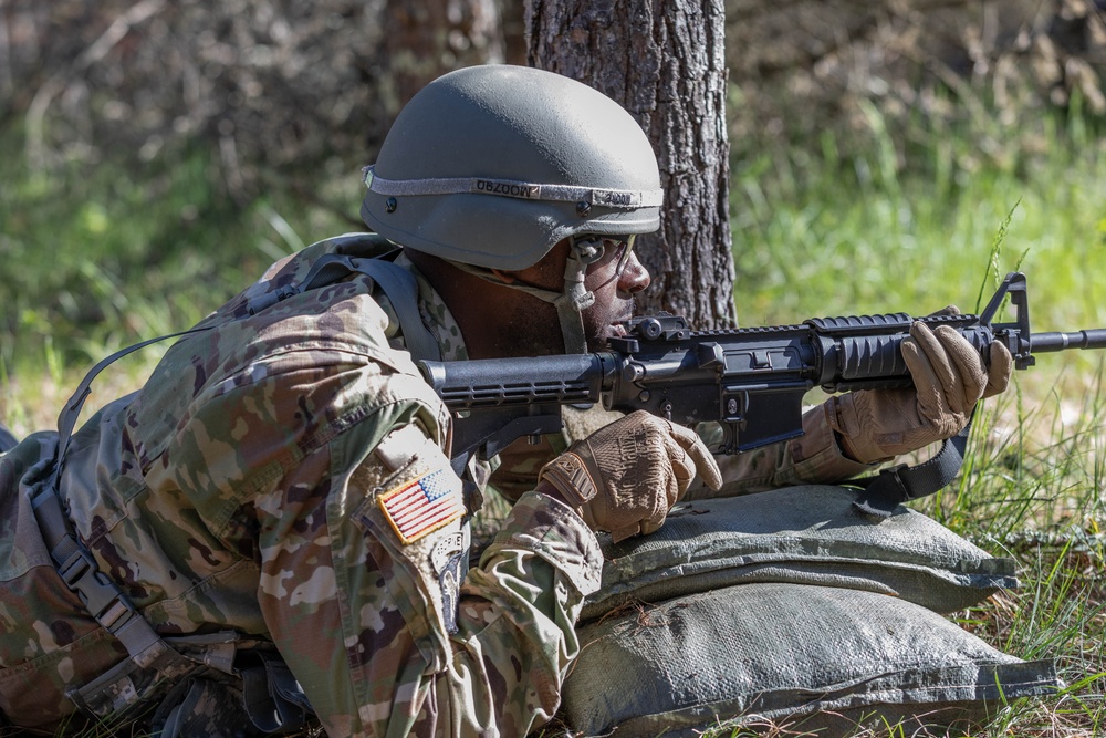 Staff Sgt. Mark Moore provides suppressing fire