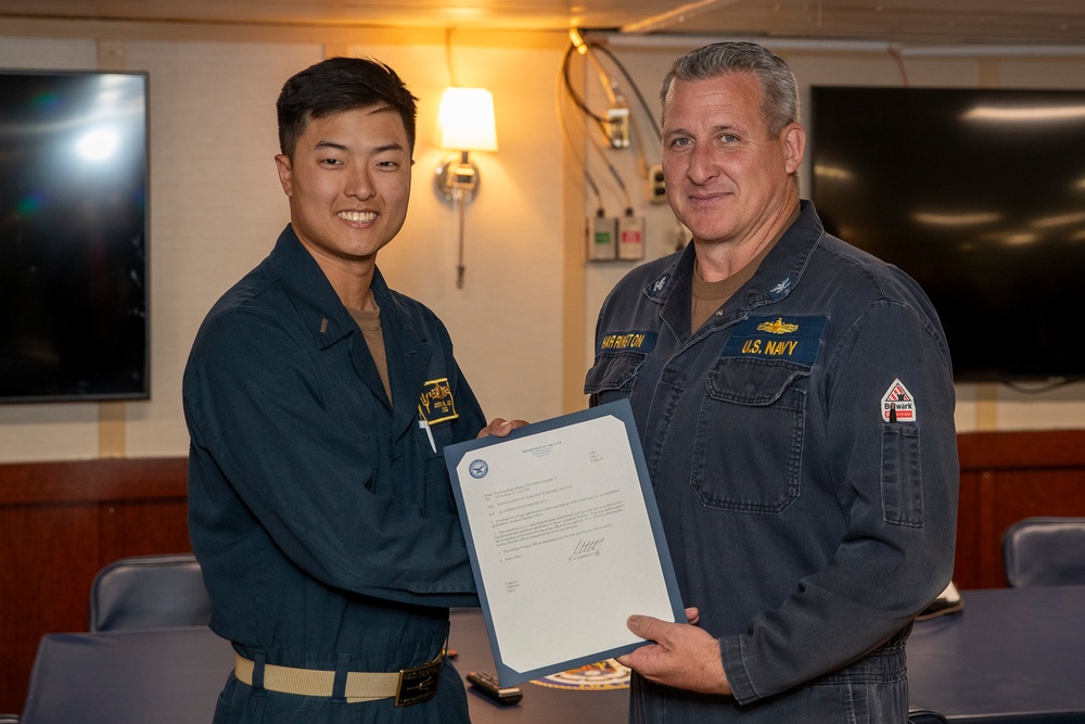 DVIDS - Images - Lt. j.g. Joo recives his SWO pin [Image 1 of 2]