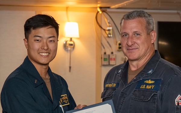 Lt. j.g. Joo recives his SWO pin