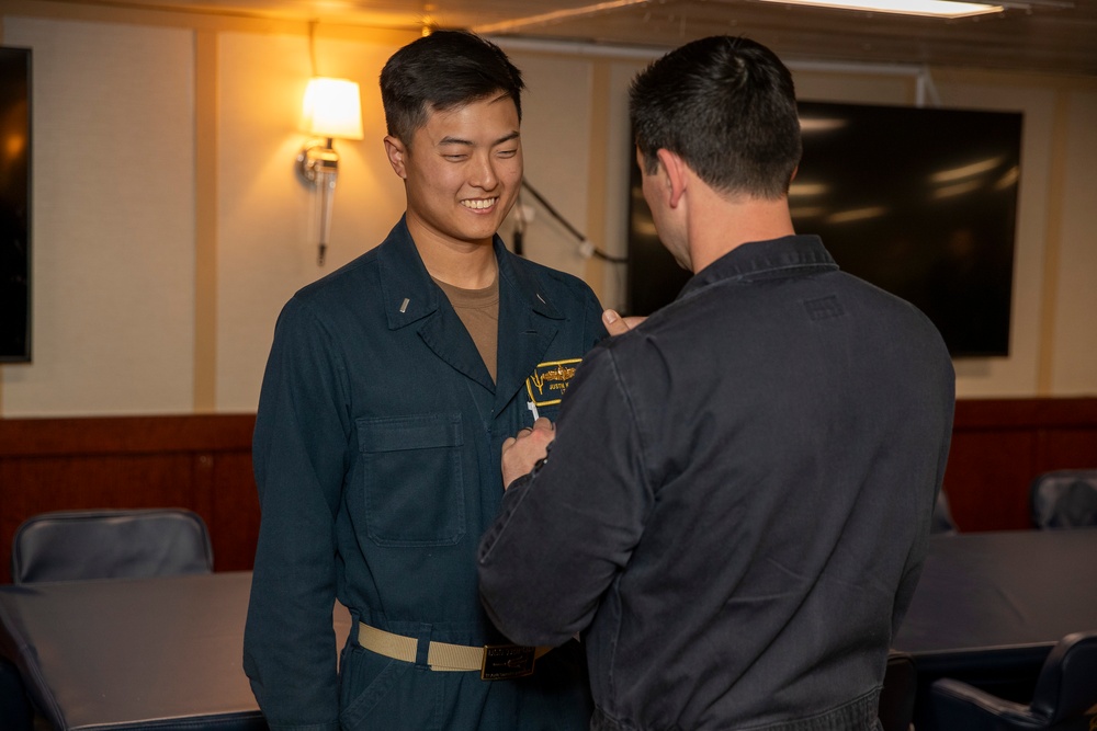 Lt. j.g. Joo recives his SWO pin