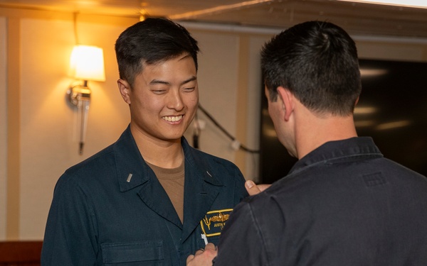 Lt. j.g. Joo recives his SWO pin