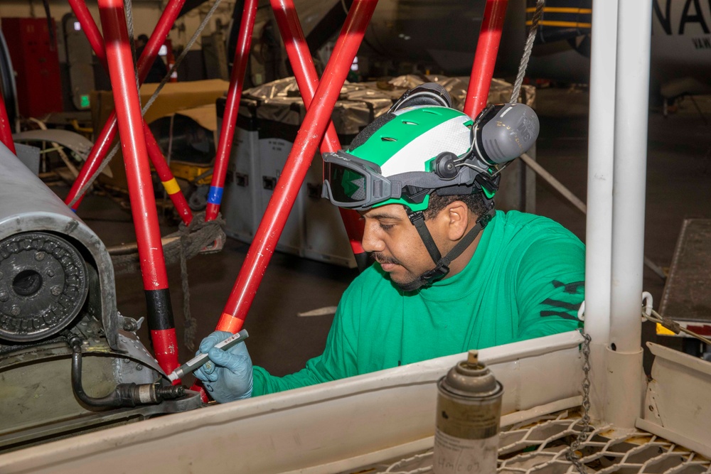 Sailors conduct aircraft maintenance aboard Abraham Lincoln