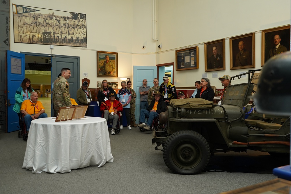 Historian Explains 29th Infantry Division Exhibit to Veterans