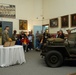 Historian Explains 29th Infantry Division Exhibit to Veterans