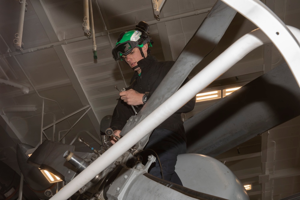 Sailors conduct aircraft maintenance aboard Abraham Lincoln
