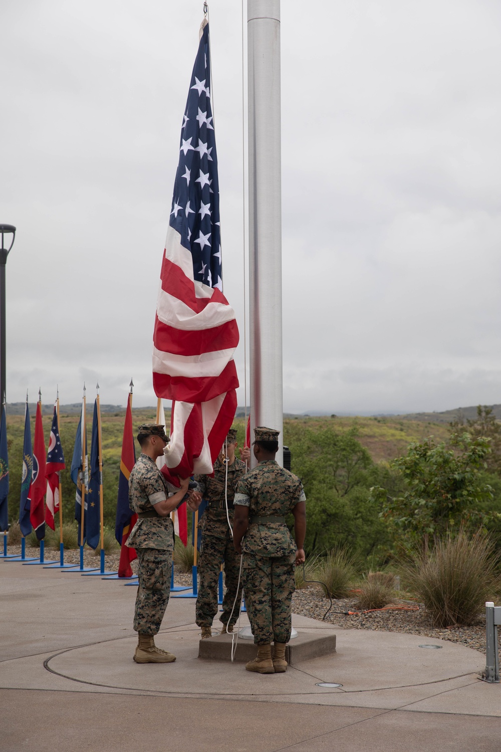 U.S. Marines with 1st MARDIV hold morning colors ceremony