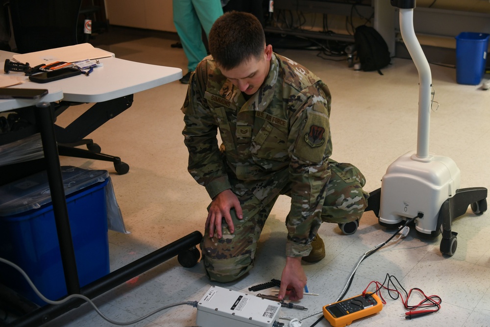 Air National Guardsmen gains experience repairing biomedical equipment at TAMC