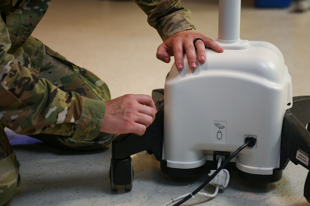 Air National Guardsmen gains experience repairing biomedical equipment at TAMC