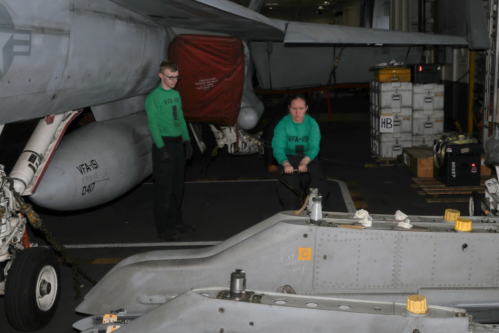 Sailors conduct aircraft maintenance aboard Abraham Lincoln