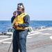 Sailors aboard the USS Howard conduct flight quarters in the North Pacific Sea