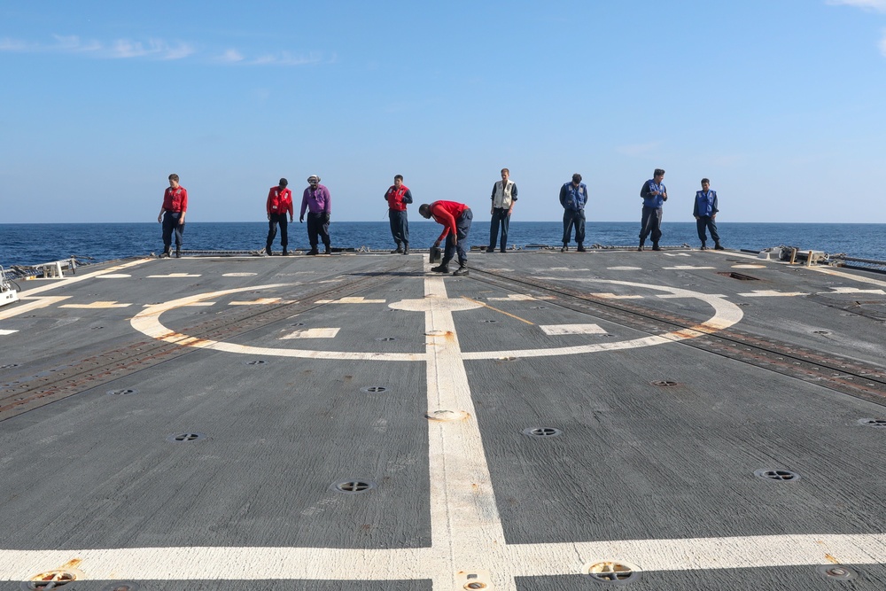 Sailors aboard the USS Howard conduct flight quarters in the North Pacific Sea