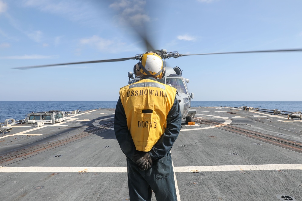 Sailors aboard the USS Howard conduct flight quarters in the North Pacific Sea