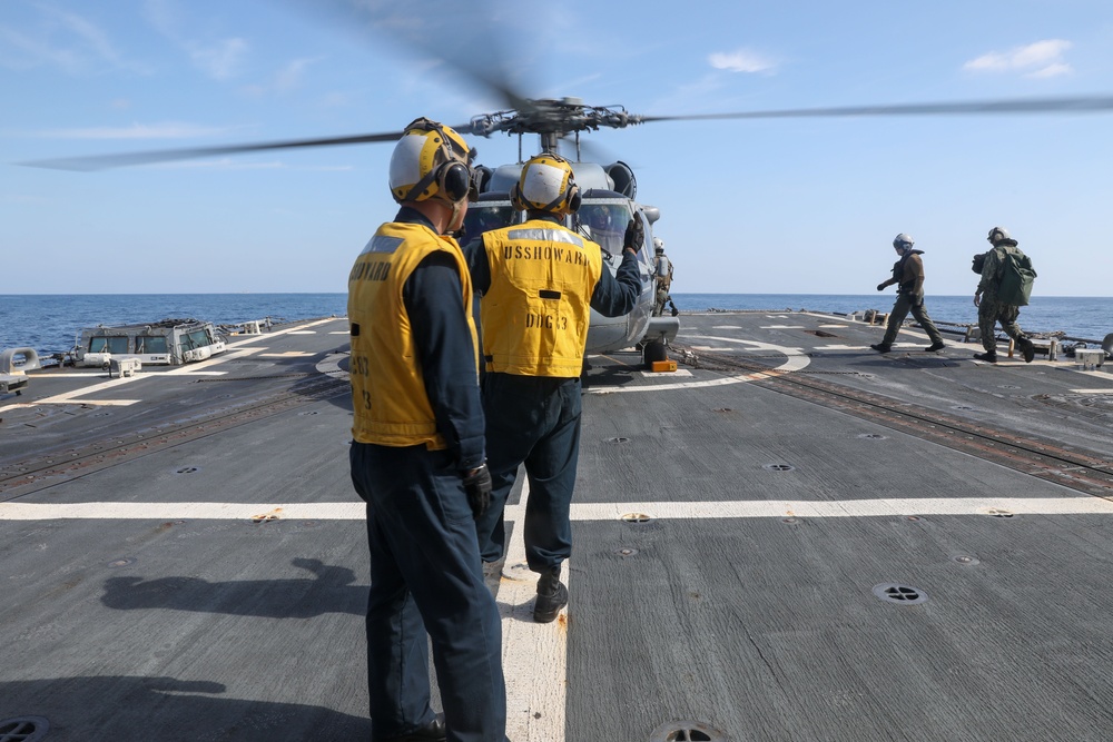 Sailors aboard the USS Howard conduct flight quarters in the North Pacific Sea