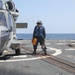 Sailors aboard the USS Howard conduct flight quarters in the North Pacific Sea