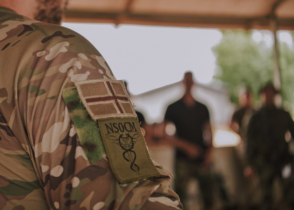 Members from the Royal Moroccan Armed Forces attend a Tactical Combat Casualty Course presentation led by the Norwegian Special Operation Forces during Flintlock 24