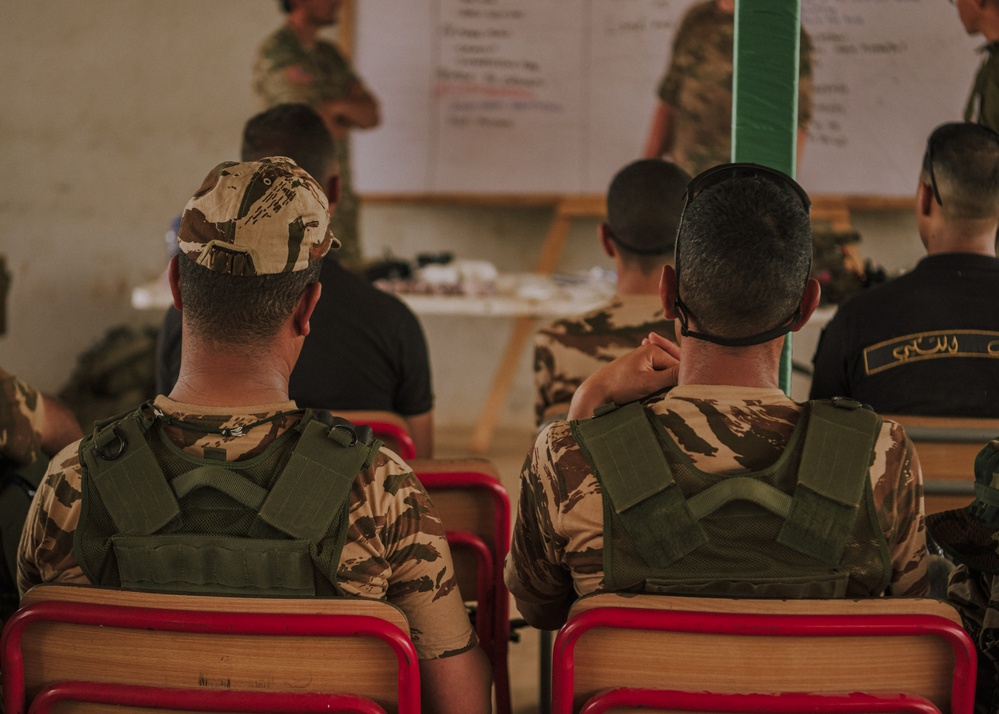 Members from the Royal Moroccan Armed Forces attend a Tactical Combat Casualty Course presentation led by the Norwegian Special Operation Forces during Flintlock 24