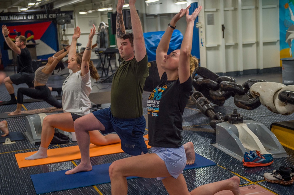 USS Ronald Reagan (CVN 76) Sailors participate in morning yoga class