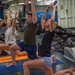 USS Ronald Reagan (CVN 76) Sailors participate in morning yoga class