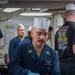 USS Ronald Reagan (CVN 76) Sailors serve brunch during holiday routine