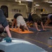 USS Ronald Reagan (CVN 76) Sailors participate in morning yoga class