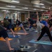 USS Ronald Reagan (CVN 76) Sailors participate in morning yoga class