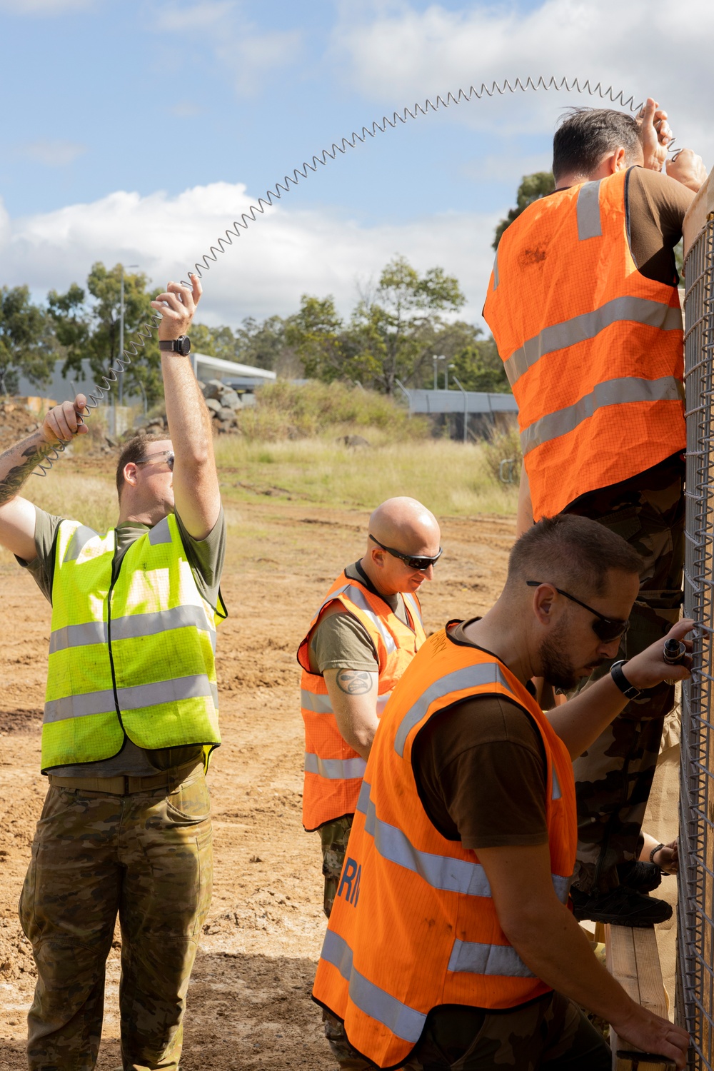 MRF-D 24.3: U.S., Australia, France, Canada service members assemble HESCO concertainers during exercise Wallaby Walk 24