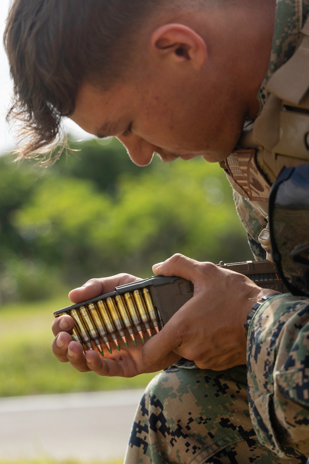 Marines with 3rd Intelligence Battalion conduct an M249 light machine gun range