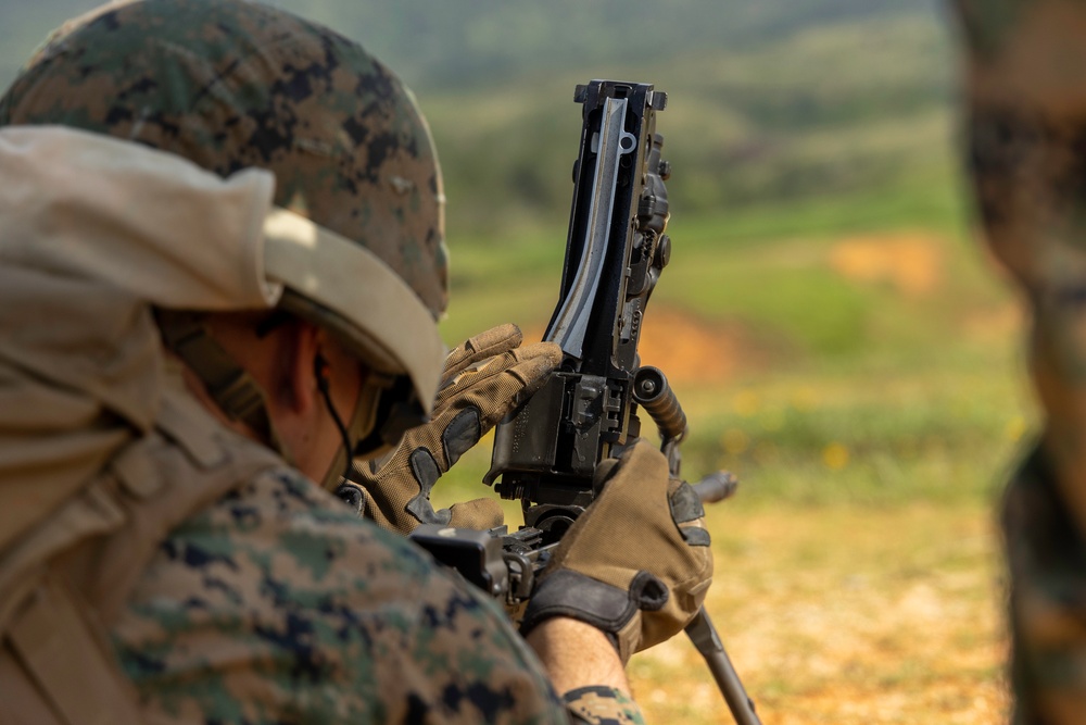 Marines with 3rd Intelligence Battalion conduct an M249 light machine gun range